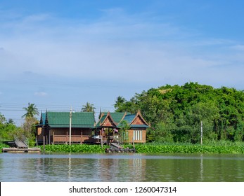 Beautiful view of Thai houses side at the Chao Phraya river in Bangkok, Thailand. Space for text.