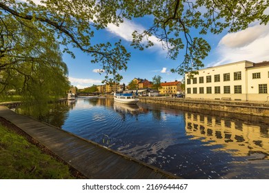 Beautiful view of tourist excursion boat on cityscape background. Sweden. Uppsala. 05.14.2022.