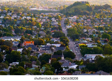 Beautiful View Of A Town In Auckland, New Zealand. Cloud Sunset And Town, View From Mt. Eden.