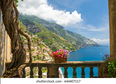 Beautiful View Of The Town Of Positano From Antique Terrace With Flowers, Amalfi Coast, Italy. Balcony With Flowers.