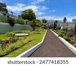 A beautiful view of the tropical garden Los Jardines del Marquesado de la Quinta Roja, La Orotava, Tenerife. Park with flowers, palms and historical buildings.