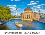 Beautiful view of UNESCO World Heritage Site Museumsinsel (Museum Island) with excursion boat on Spree river, Berlin, Germany