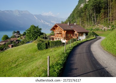 Beautiful View Of The Village On The Lake Shore In Swiss Alps Mountains. Summer Landscape.