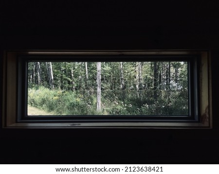 Similar – View through the reflective pane over a terrace onto the coast of Western Canada