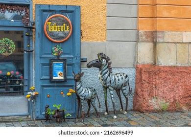 Beautiful view of zebra figures as decoration of entrance to old building. Sweden. Uppsala. 05.14.2022.