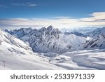 The beautiful view from the Zugspitze summit on the Alps on a frosty winter day. Bavarian Alps, Germany. Zugspitze Ski Resort. Winter in the Bavarian Alps. 