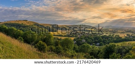 Beautiful views west over the village of Poynings from Devils Dyke to Chanctonbury ring on the south downs in west Sussex south east England UK