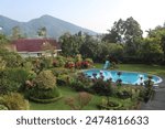 Beautiful villa with a swimming pool overlooking a scenic mountain view, at Puncak Bogor, Indonesia