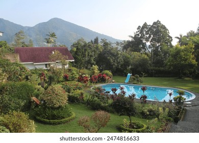 Beautiful villa with a swimming pool overlooking a scenic mountain view, at Puncak Bogor, Indonesia - Powered by Shutterstock