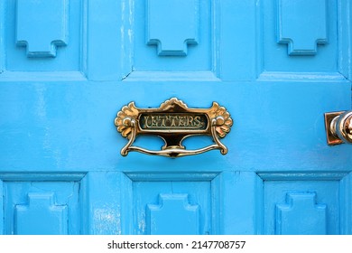 Beautiful vintage blue door with mailslot, box in the UK