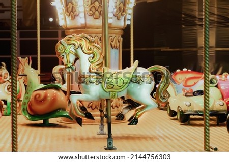 Beautiful vintage fair horse carousel in amusement park