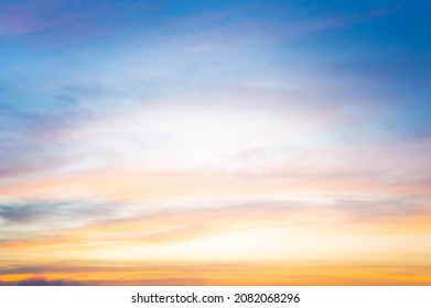 Beautiful Vivid sky painted by the sun leaving bright golden shades.Dense clouds in twilight sky in winter evening.Image of cloud sky on evening time.Evening Vivid sky with clouds. - Shutterstock ID 2082068296