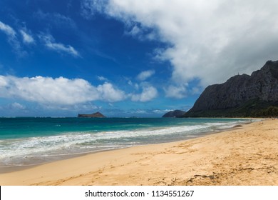 Beautiful Waimanalo beach with turquoise water and cloudy sky, Oahu coastline, Hawaii