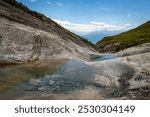 A beautiful walk on alp mora in Switzerland, Natural pools created by the glacier, Bargis, Hike from Trin