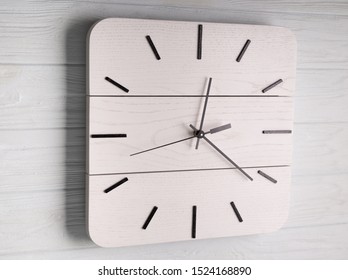 Beautiful Wall Clock Made of Wood on Wood Background