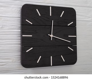 Beautiful Wall Clock Made of Wood on Wood Background