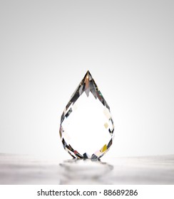 a beautiful water drop-shape crystal, highlight at the middle of the object