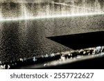 A beautiful water fountain illuminated at night, with gentle cascading streams creating ripples and reflections on the surface, enhancing the tranquility of a modern architectural setting.