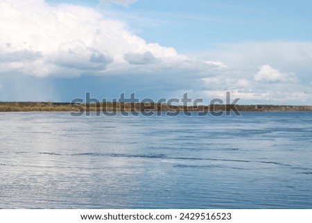 beautiful water shore in summer big cloud
