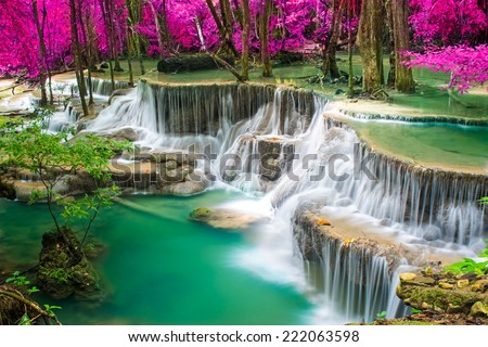 Beautiful waterfall in autumn forest 