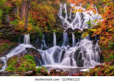 Beautiful Waterfall In Autumn Forest In Jonkoping, Sweden. Long Exposure. Selective Focus.