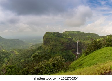 Beautiful waterfall with dramatic sky, somewhere in the Sahyadri ranges of western ghats of Maharashtra - Shutterstock ID 2062700504