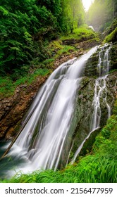 A beautiful waterfall from a forest river landscape. Waterfall landscape - Shutterstock ID 2156477959