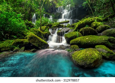 beautiful waterfall in green forest in jungle at phu tub berk mountain , phetchabun , Thailand - Powered by Shutterstock