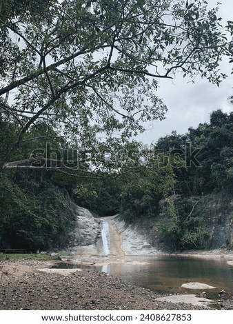 A beautiful waterfall hidden in the middle of a beautiful forest. Sumbawa , NTB