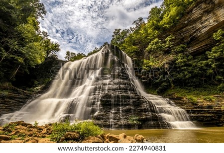 Beautiful waterfall from the mountain. Mountain waterfall landscape. Waterfall cascades view. Forest waterfall in mountains