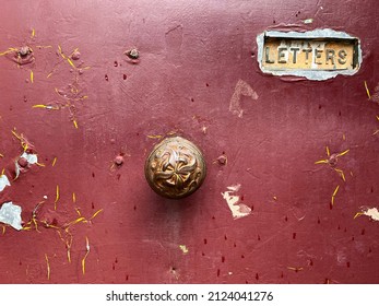 Beautiful weathered antique vintage door with letter box and door knob