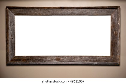 Beautiful Weathered And Worn Wood Frame Hanging On Wall. Interior Decor Element With Blank Copy Space For Your Text Or Image.