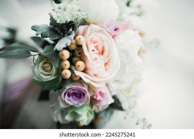 Beautiful wedding bouquet with different flowers, roses