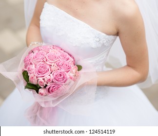 Beautiful wedding bouquet in hands of the bride - Shutterstock ID 124514119