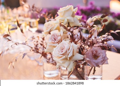 Beautiful wedding ceremony interior and table decor, flower decoration with flowers bouquet, with roses, tulips, peonies in pink and golden color tones
 - Shutterstock ID 1862841898