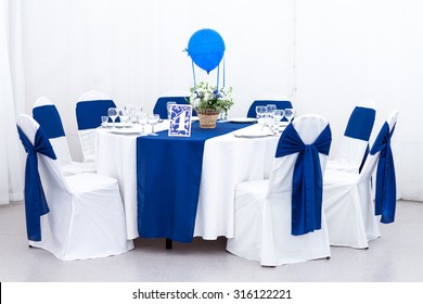 Beautiful Wedding Chair And Table Setting For Fine Dining In Blue And White Color