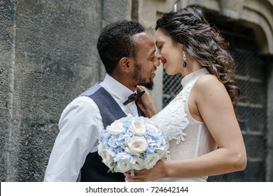 Beautiful wedding couple celebrating their wedding day ,happy african american groom and caucasian bride