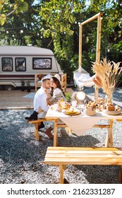 Beautiful Wedding Couple Laugh And Kiss Relaxing In Rv, Camping In A Trailer. Romantic Moment. Together. Wedding. Marriage.