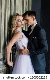 Beautiful Wedding Couple. Luxurious Dress Of The Bride And Stylish Suit Of The Groom.