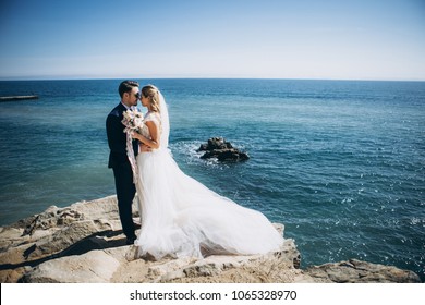 Beautiful Wedding Couple On Their Wedding Photoshoot By The Sea