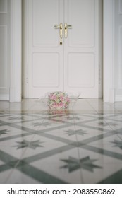 Beautiful Wedding Rose Bouquet On Shiny Tile Floor With No Bride And White Retro Door Background