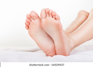 Beautiful well-groomed female a foot and a heel on a white background - Shutterstock ID 143539537