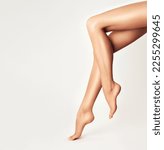 Beautiful well-groomed female legs . Foot care . Depilation of hair on the feet .Skin care and cosmetology , and pedicure