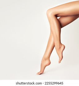 Beautiful well-groomed female legs . Foot care . Depilation of hair on the feet .Skin care and cosmetology , and pedicure - Shutterstock ID 2255299645
