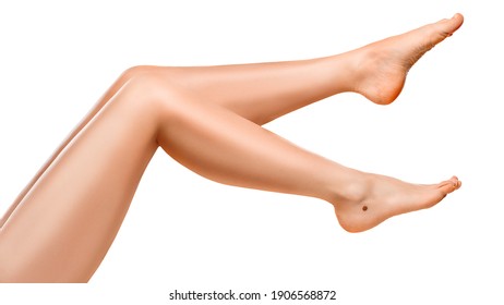 Beautiful well-groomed women's legs close-up on a white isolated background, The concept of epilation of foot skin care or getting rid of cellulite.