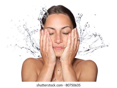 Beautiful wet woman face with water drop. Close-up portrait on white background