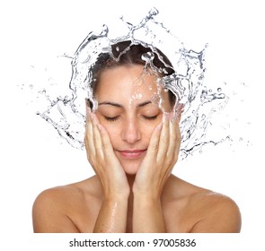Beautiful wet woman face with water drop. Close-up portrait on white background