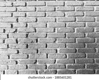 Beautiful white bricks pattern on the wall. It’s modern and clean texture. Premium loft style.