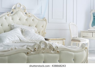 beautiful white bright clean interior bedroom in luxurious baroque style. - Shutterstock ID 438868243