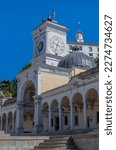 Beautiful white building  with arches, clock tower, Torre dell